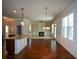 Large kitchen with island and views into the living room at 168 Waypoint Dr, Stockbridge, GA 30281