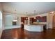 Island kitchen with granite countertops and hardwood floors at 168 Waypoint Dr, Stockbridge, GA 30281