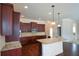 Modern kitchen with granite countertops, stainless steel appliances, and hardwood floors at 168 Waypoint Dr, Stockbridge, GA 30281