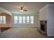 Large living room with stone fireplace and bay windows at 168 Waypoint Dr, Stockbridge, GA 30281
