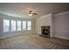 Large living room with stone fireplace and bay windows at 168 Waypoint Dr, Stockbridge, GA 30281