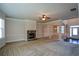 Open living room with views into kitchen and dining areas at 168 Waypoint Dr, Stockbridge, GA 30281