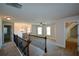 Spacious loft area with high ceilings, wood railing, and multiple windows at 168 Waypoint Dr, Stockbridge, GA 30281