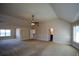 Main bedroom with vaulted ceiling, carpet, and ensuite bathroom at 168 Waypoint Dr, Stockbridge, GA 30281