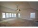 Large main bedroom with vaulted ceiling, carpet, and multiple windows at 168 Waypoint Dr, Stockbridge, GA 30281
