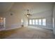 Main bedroom with vaulted ceiling and access to bathroom and hallway at 168 Waypoint Dr, Stockbridge, GA 30281