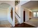 Elegant staircase with wrought-iron railings and hardwood steps at 168 Waypoint Dr, Stockbridge, GA 30281