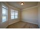 Bright study or office with large windows and neutral decor at 168 Waypoint Dr, Stockbridge, GA 30281