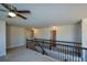 Upstairs hallway with carpet and access to bedrooms at 168 Waypoint Dr, Stockbridge, GA 30281