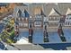 Aerial view of townhouses with attached garages and landscaping at 5056 Ridgemont Se Walk # 20, Atlanta, GA 30339