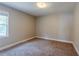 Spacious bedroom with large window and carpet at 1965 Meadow Ln, Decatur, GA 30032