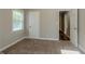 Bright bedroom with a door to hallway at 1965 Meadow Ln, Decatur, GA 30032