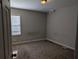 Spacious bedroom with neutral walls and carpeted floors at 1965 Meadow Ln, Decatur, GA 30032