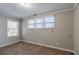 Spacious bedroom with neutral walls and carpet at 1965 Meadow Ln, Decatur, GA 30032