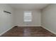 Empty bedroom with wood flooring and a window at 2683 Rockcliff Se Rd, Atlanta, GA 30316