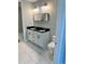 Double vanity bathroom with marble flooring and modern fixtures at 711 Cosmopolitan Ne Dr # 426, Atlanta, GA 30324