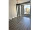 Spacious bedroom with hardwood floors, ceiling fan, and large window at 711 Cosmopolitan Ne Dr # 426, Atlanta, GA 30324