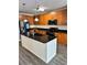 Spacious kitchen with island, stainless steel appliances, and wood cabinets at 711 Cosmopolitan Ne Dr # 426, Atlanta, GA 30324