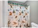 Charming bathroom with a whimsical shower curtain at 2555 Flat Shoals Rd # 1801, Atlanta, GA 30349