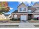 Brick townhouse with a two-car garage and well-maintained landscaping at 2555 Flat Shoals Rd # 1801, Atlanta, GA 30349