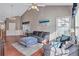Open living area with hardwood floors, neutral decor and lots of natural light at 2555 Flat Shoals Rd # 1801, Atlanta, GA 30349
