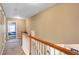 Upstairs hallway with carpet and access to bedrooms at 2555 Flat Shoals Rd # 1801, Atlanta, GA 30349