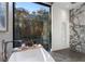 Spa-like bathroom with marble shower and a freestanding bathtub at 2716 Ridgewood Nw Rd, Atlanta, GA 30327