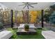 Relaxing covered patio with artificial turf and wooded views at 2716 Ridgewood Nw Rd, Atlanta, GA 30327