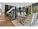 Elegant dining room with glass table, white chairs, and treetop views at 2716 Ridgewood Nw Rd, Atlanta, GA 30327
