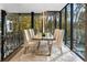 Modern dining room with glass top table and white chairs at 2716 Ridgewood Nw Rd, Atlanta, GA 30327