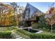Modern home with black exterior, long water feature, and stone pathway at 2716 Ridgewood Nw Rd, Atlanta, GA 30327