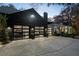 Three-car garage with glass doors and modern lighting at 2716 Ridgewood Nw Rd, Atlanta, GA 30327