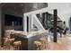Modern home bar features marble countertop, gold stools, and a view into the great room at 2716 Ridgewood Nw Rd, Atlanta, GA 30327
