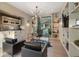 Modern home office with built-in shelving and glass doors leading to the backyard at 2716 Ridgewood Nw Rd, Atlanta, GA 30327