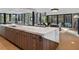 Modern kitchen with large marble island and wood cabinets at 2716 Ridgewood Nw Rd, Atlanta, GA 30327