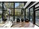 Living area with floor-to-ceiling windows overlooking the pool at 2716 Ridgewood Nw Rd, Atlanta, GA 30327