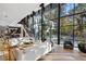 Spacious living room with large windows and a grand piano at 2716 Ridgewood Nw Rd, Atlanta, GA 30327