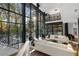 Open living space with floor-to-ceiling windows and pool view at 2716 Ridgewood Nw Rd, Atlanta, GA 30327