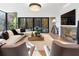 Spacious living room with a fireplace and large windows at 2716 Ridgewood Nw Rd, Atlanta, GA 30327