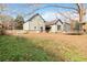 Large backyard with home view, and mature trees at 4900 Lilburn Stone Mountain Sw Rd, Lilburn, GA 30047