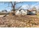 Backyard with playset, large tree, and a bench at 4900 Lilburn Stone Mountain Sw Rd, Lilburn, GA 30047