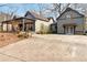 Home with detached garage and large driveway, offering ample parking space at 4900 Lilburn Stone Mountain Sw Rd, Lilburn, GA 30047