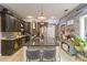 Eat-in kitchen with large island, ample counter space, and stylish pendant lights at 4900 Lilburn Stone Mountain Sw Rd, Lilburn, GA 30047