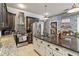 Updated kitchen with dark wood cabinets, granite counters, and stainless steel appliances at 4900 Lilburn Stone Mountain Sw Rd, Lilburn, GA 30047