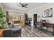 Bright living area with hardwood floors, sectional sofa, and plenty of natural light at 4900 Lilburn Stone Mountain Sw Rd, Lilburn, GA 30047