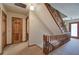 Upstairs hallway with wooden staircase and doors to bedrooms at 90 Wiley Dr, Douglasville, GA 30134