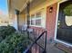 Inviting front porch with black door and lush greenery at 6820 Highway 20, Loganville, GA 30052