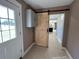 Laundry room with barn door opening to kitchen at 6820 Highway 20, Loganville, GA 30052