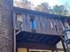 Private balcony with wooden railing at 1522 Camelot Dr, Atlanta, GA 30349