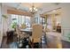 Formal dining room with round table and hardwood floors at 3050 Pleasant Valley Trl, Cumming, GA 30028